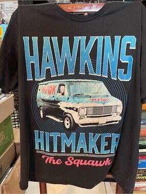 Netflix Hawkins Hitmaker Graphic Tee - Black, Blue, Pink